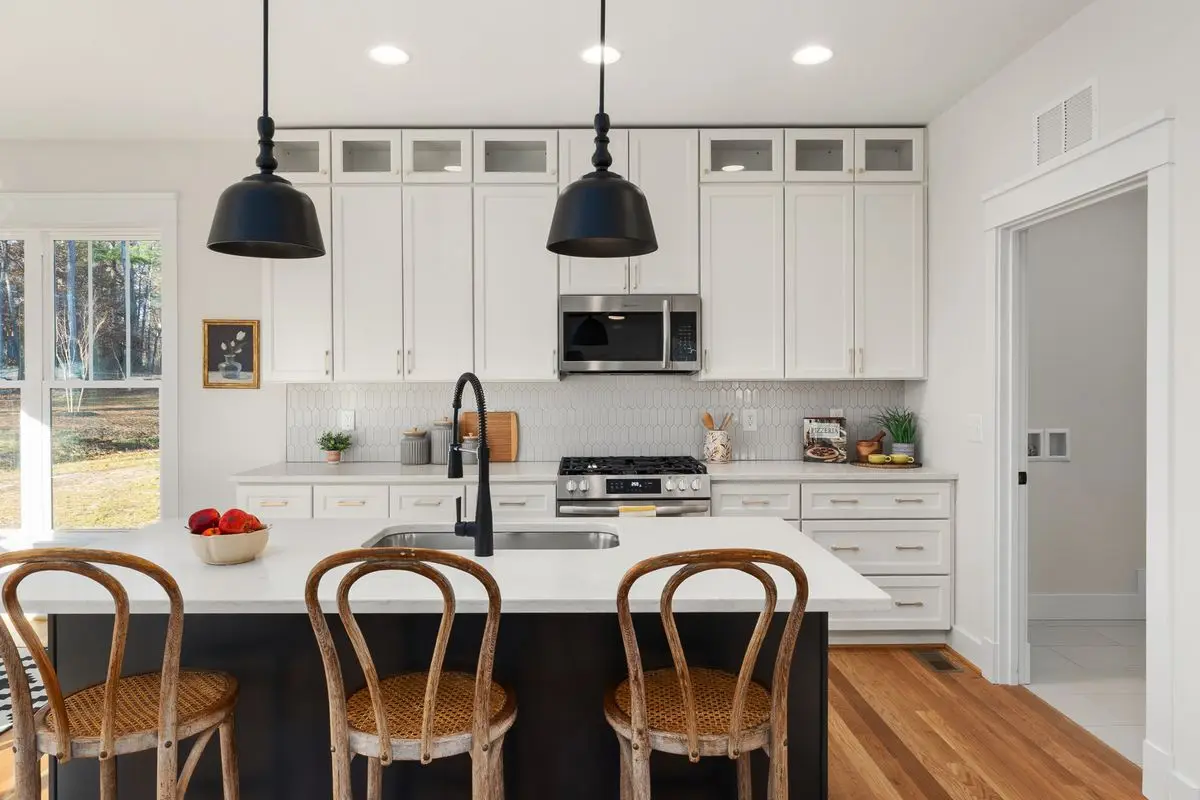 A bright residential kitchen with cabinets and counters. Arlington.