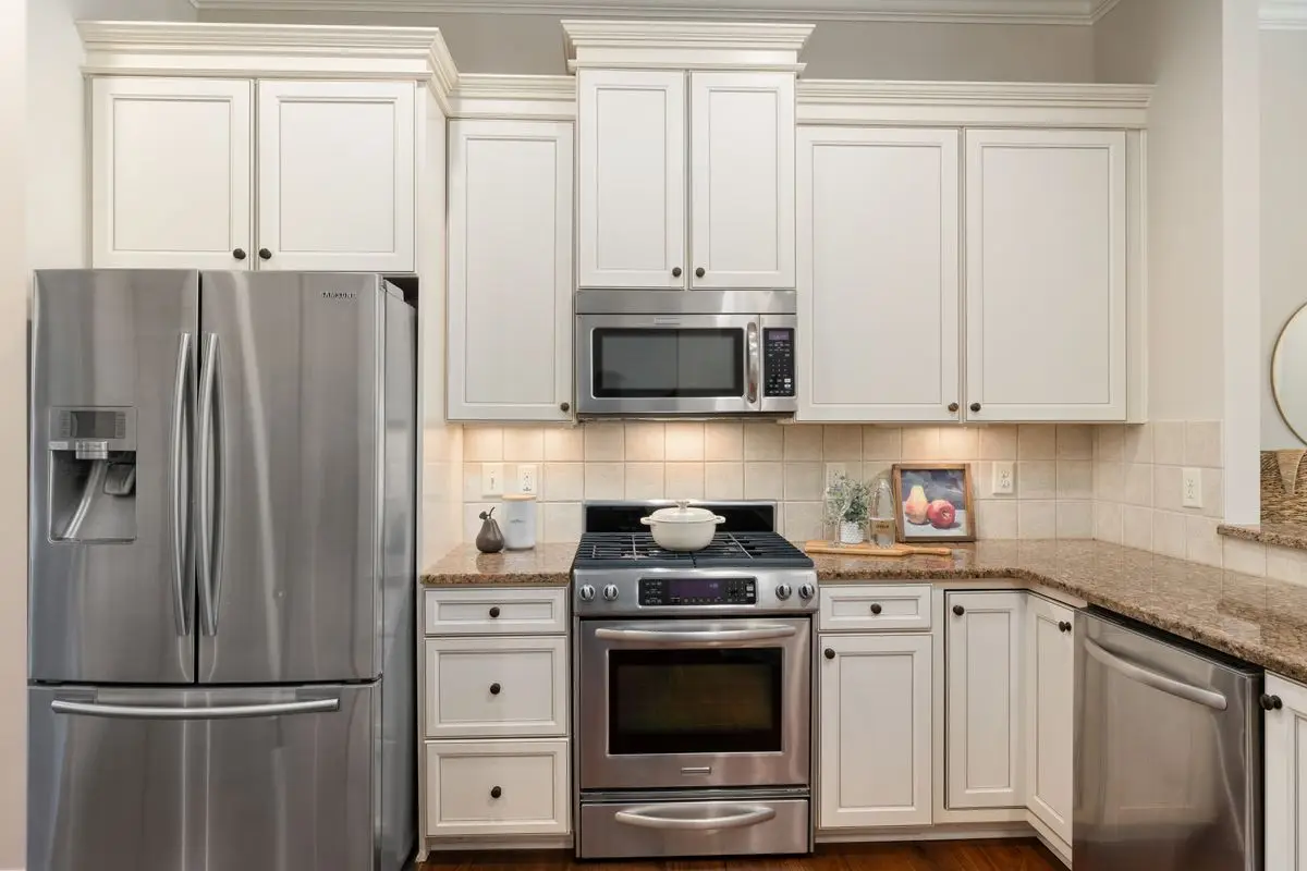 A bright residential kitchen with cabinets and counters. Arlington.