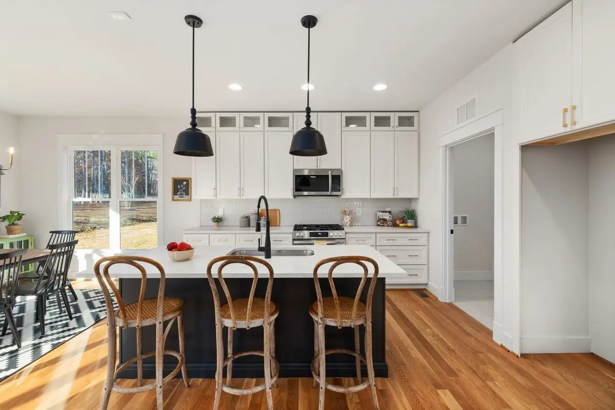 A bright residential kitchen with cabinets and counters. Arlington.