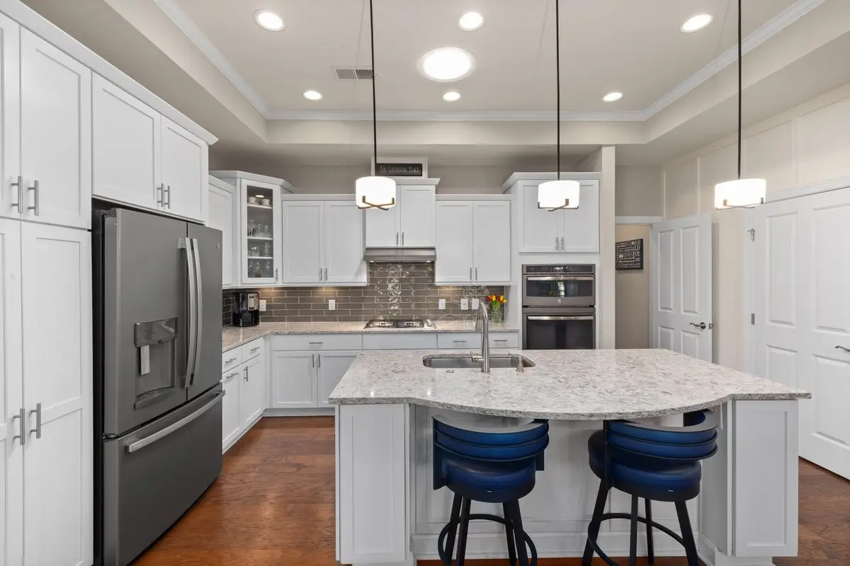 A bright residential kitchen with cabinets and counters. Arlington.